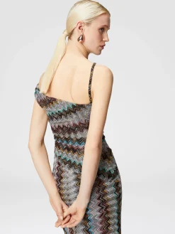Abito lungo zig zag lamé con scollatura asimmetrica