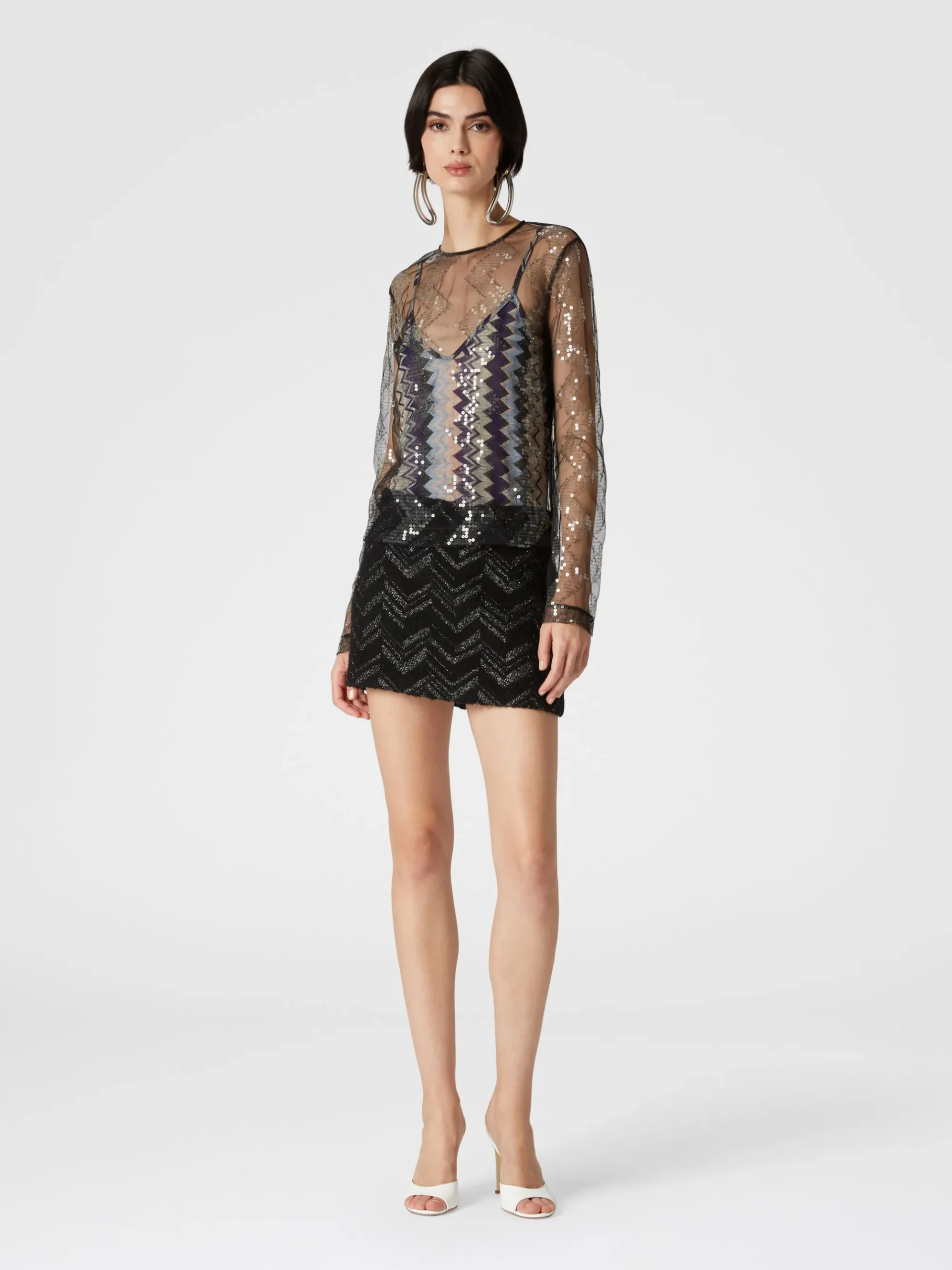 Blusa doppiata in tulle con paillettes