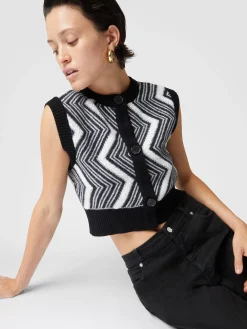 Bolero in lana con bottoni e chevron punto spugna