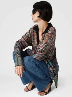 Cinque tasche in denim con inserto in maglia