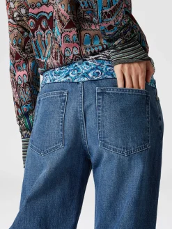 Cinque tasche in denim con inserto in maglia