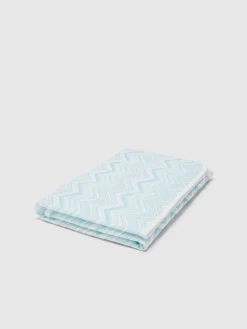 Coperta in cotone stretch zig zag con scritta logo