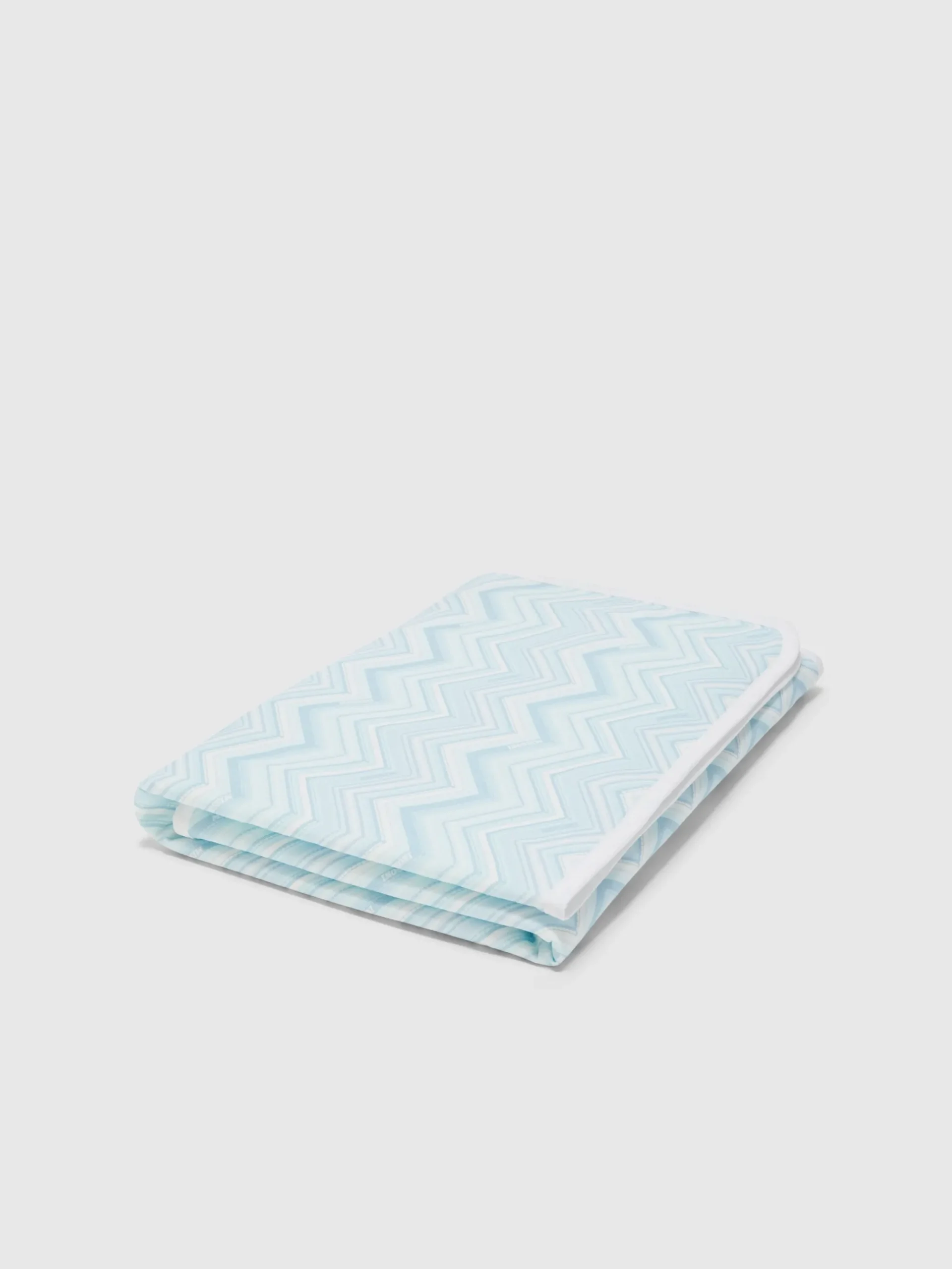 Coperta in cotone stretch zig zag con scritta logo