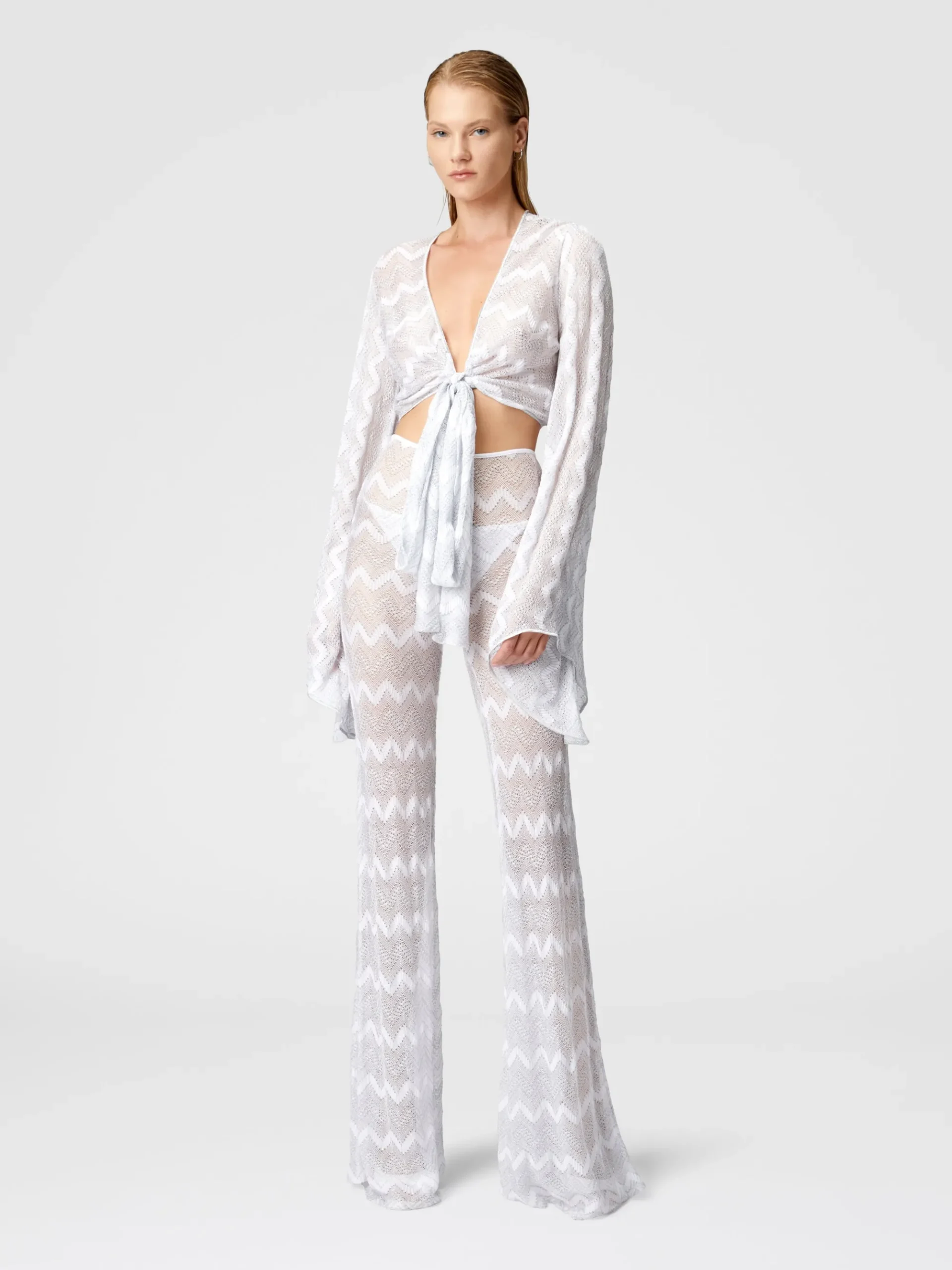 Crop top con maniche ampie e nodo frontale in viscosa zig zag lamé