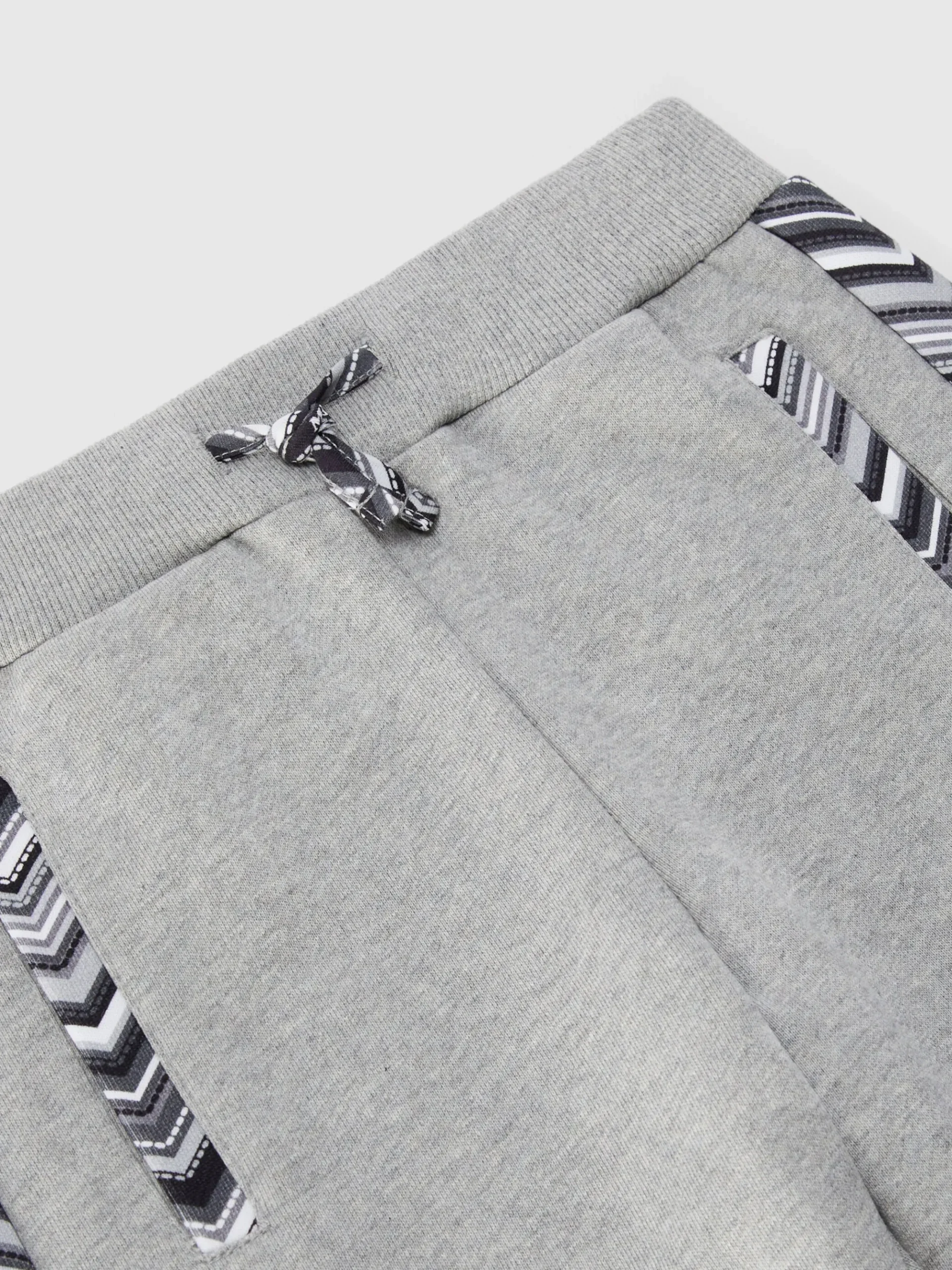 Joggers in cotone con inserti zig zag