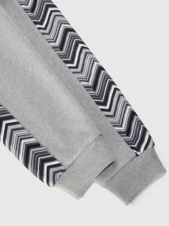 Joggers in cotone con inserti zig zag