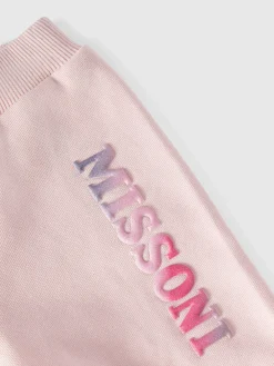 Joggers in cotone con rouches sul fondo e logo