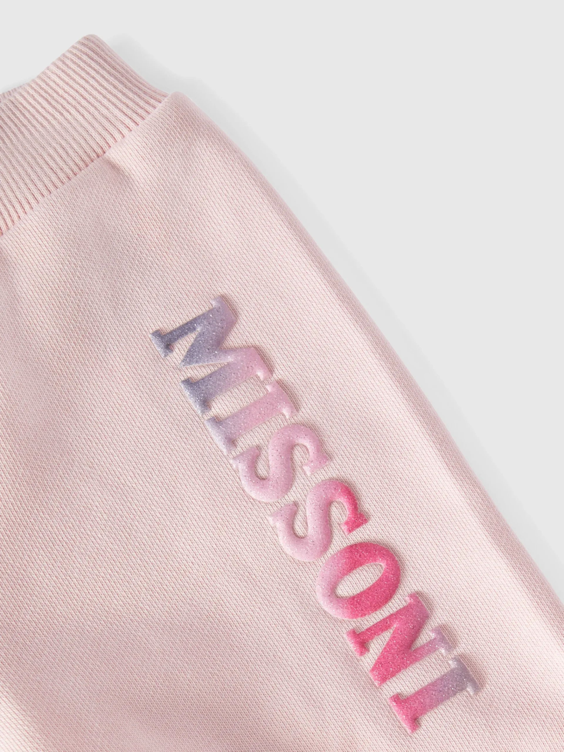 Joggers in cotone con rouches sul fondo e logo