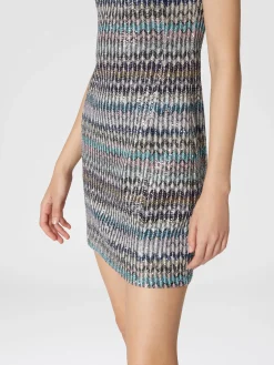 Mini-abitoin maglia lamé con scollatura a cuore