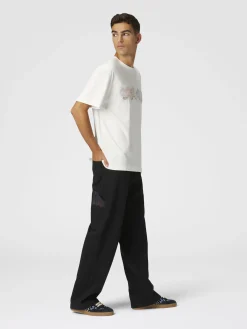 Pantaloni cargo in denim con inserti in maglia chevron