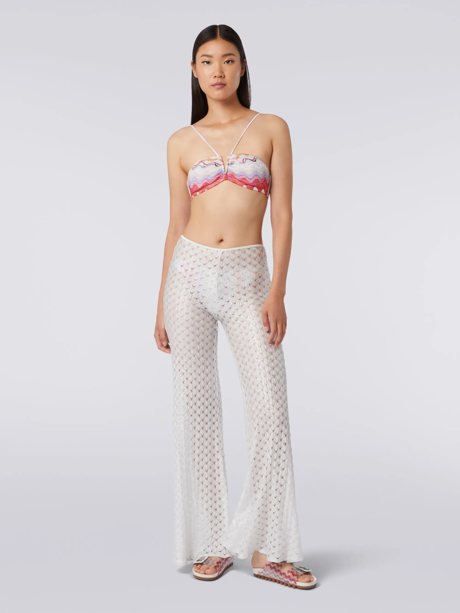 Pantaloni copricostume effetto pizzo con fondo svasato