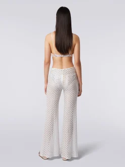 Pantaloni copricostume effetto pizzo con fondo svasato