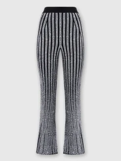 Pantaloni flare a costine zig zag con paillettes