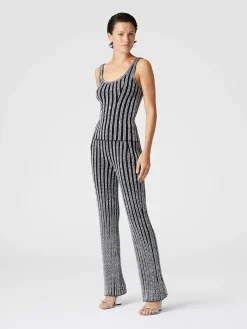 Pantaloni flare a costine zig zag con paillettes
