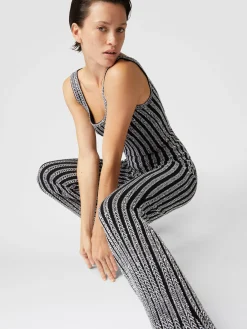Pantaloni flare a costine zig zag con paillettes