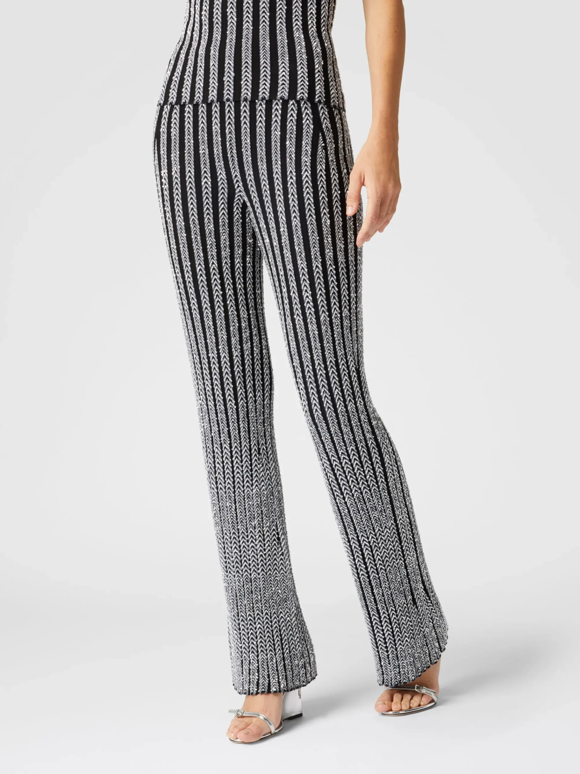 Pantaloni flare a costine zig zag con paillettes