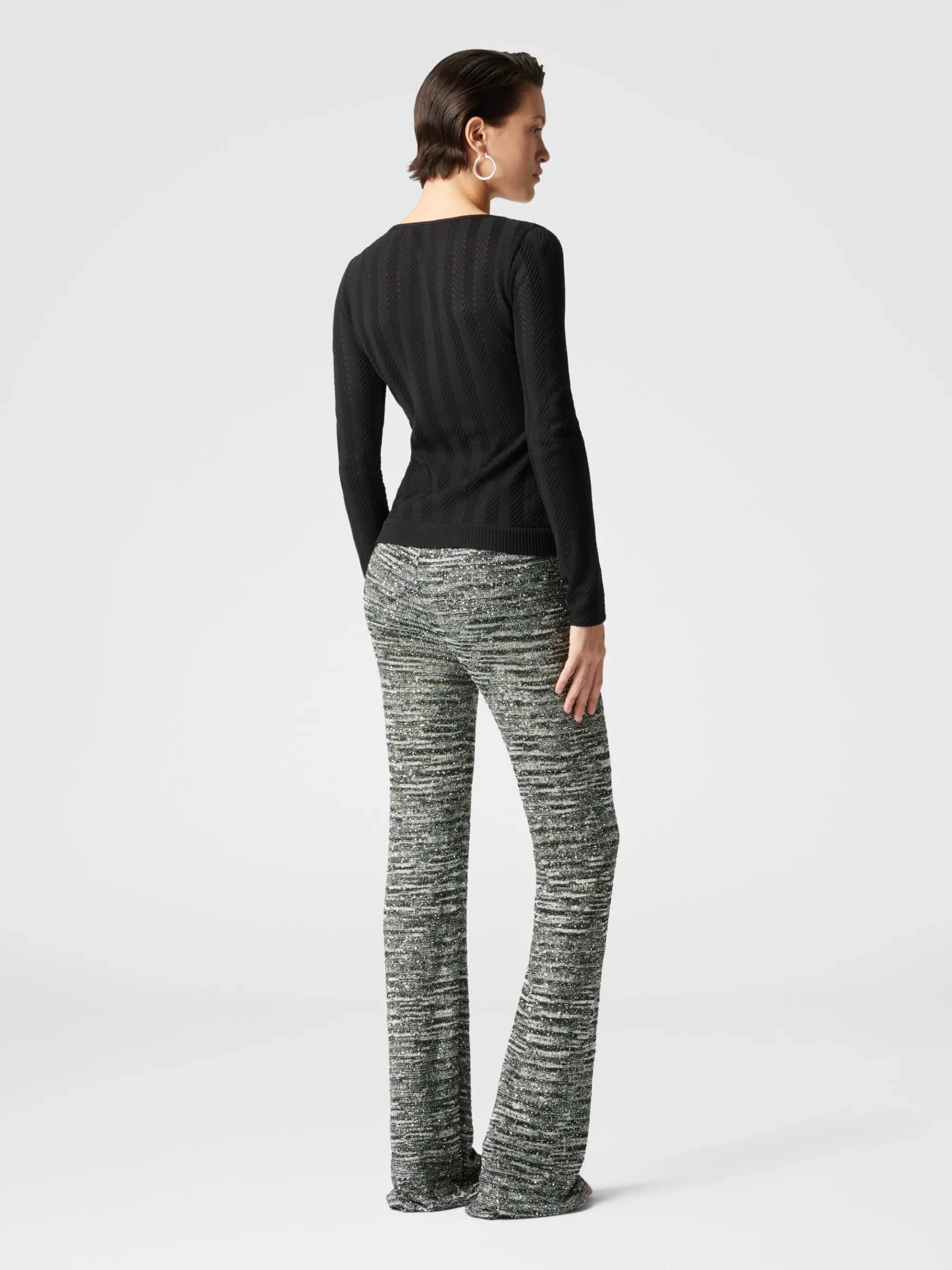 Pantaloni flare in maglia fiammata con paillettes
