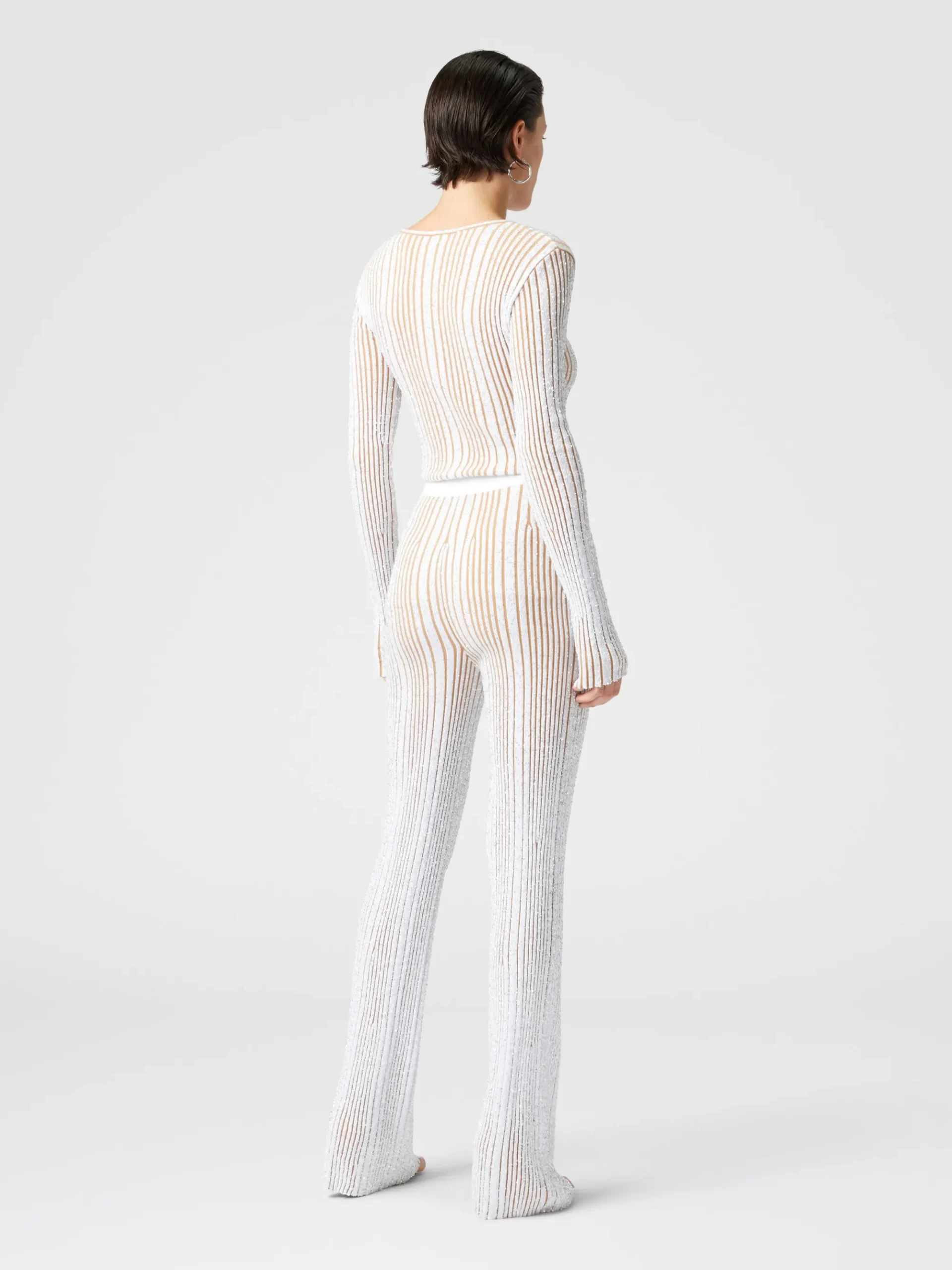 Pantaloni flare stretch a costine con paillettes
