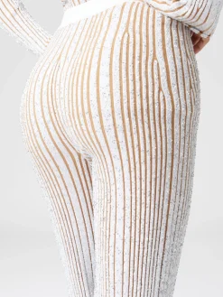 Pantaloni flare stretch a costine con paillettes