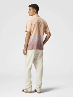Polo in cotone e lino fiammato con ricamo zig zag