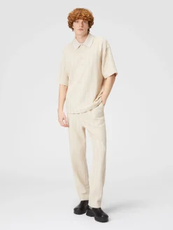Polo in maglia boxy fit con chevron tono su tono