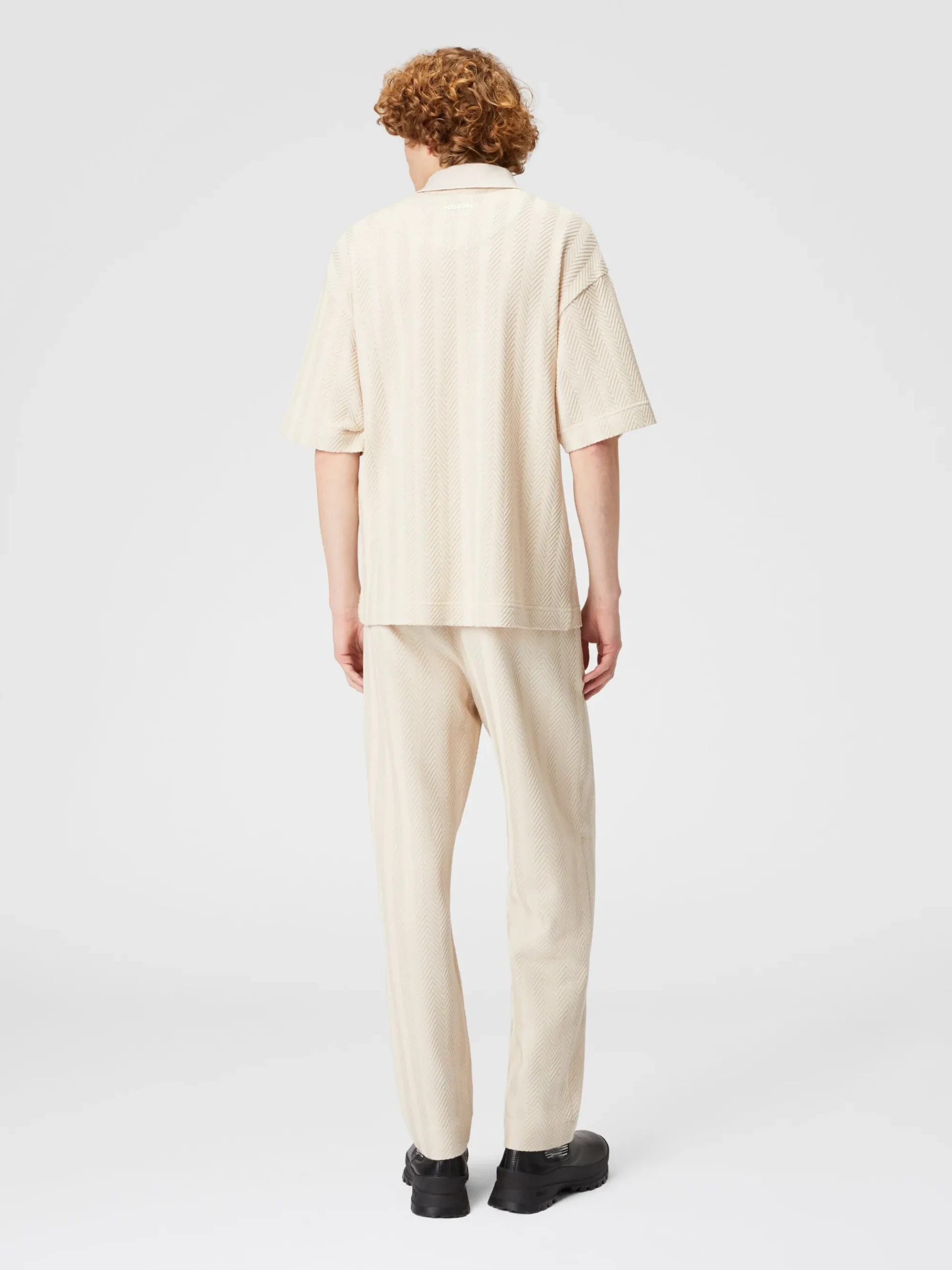 Polo in maglia boxy fit con chevron tono su tono
