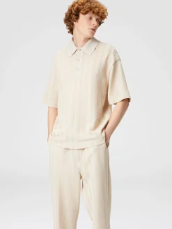 Polo in maglia boxy fit con chevron tono su tono
