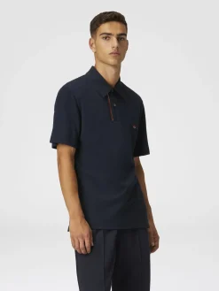Polo in piquet di cotone tinta unita con ricamo zig zag e dettaglio a contrasto