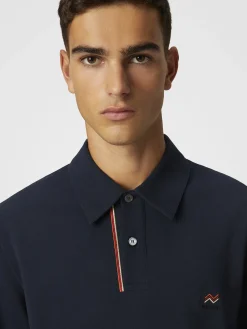 Polo in piquet di cotone tinta unita con ricamo zig zag e dettaglio a contrasto