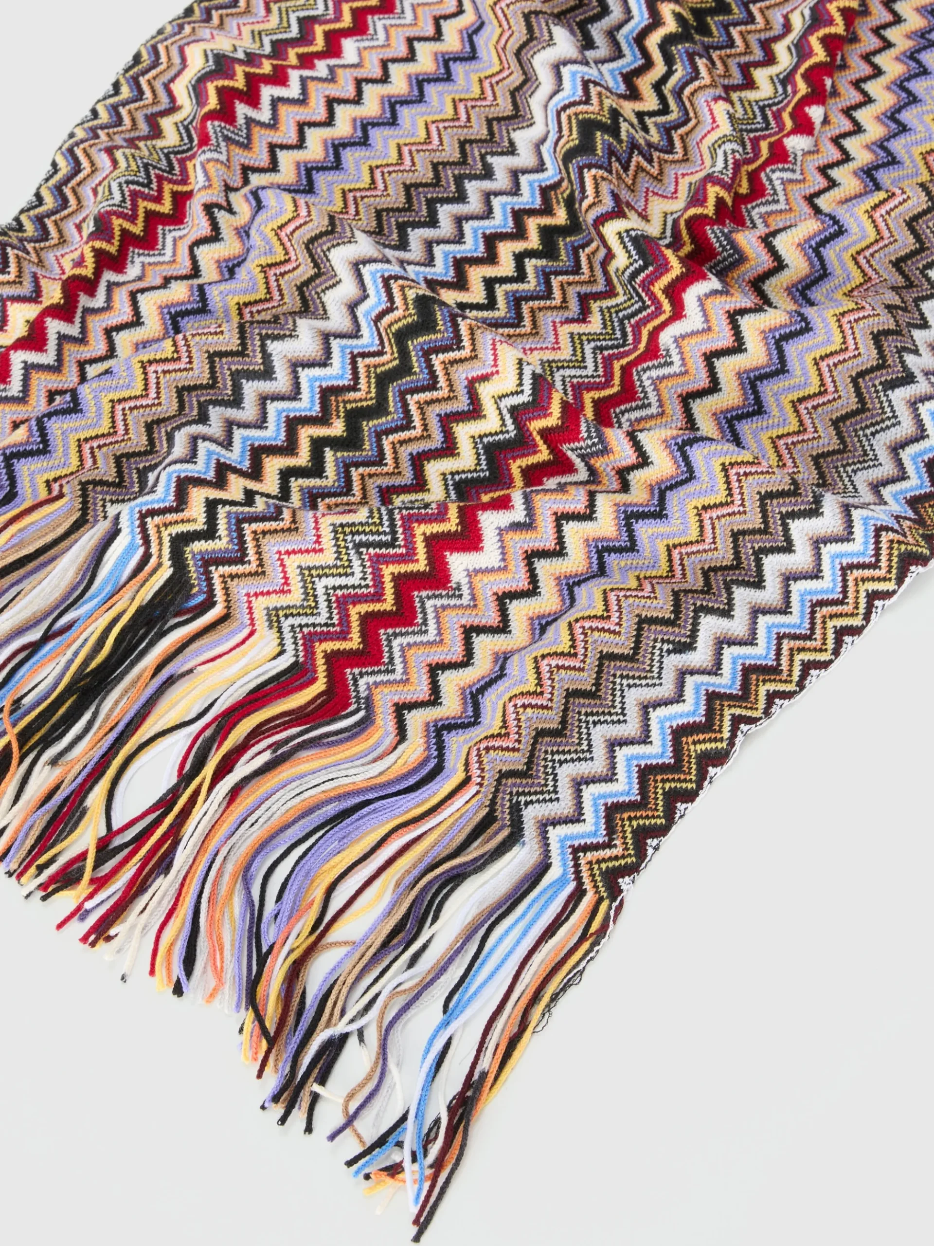 Scialle in maglia fiammata con frange