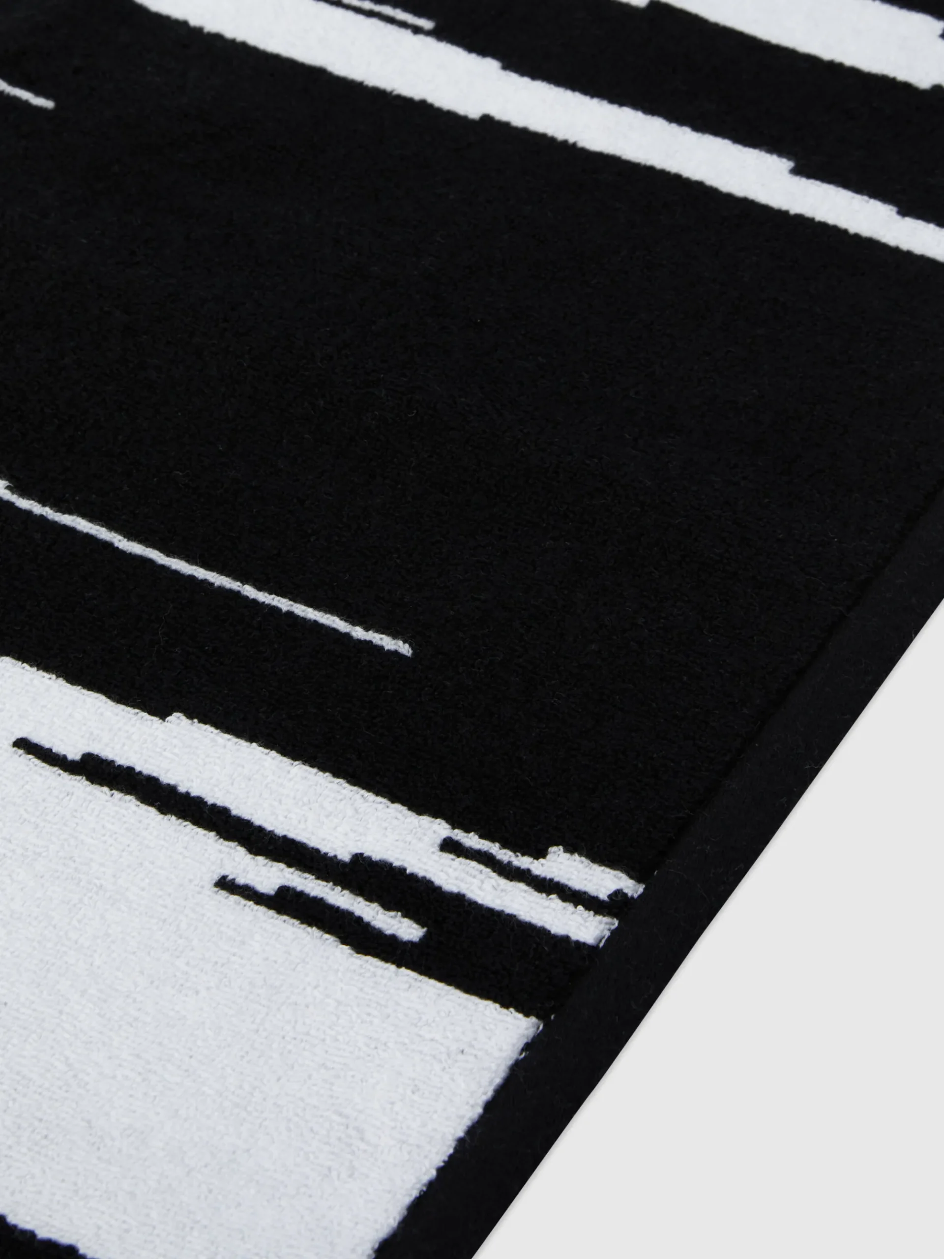 Tappetino da bagno Skunk 60x90 cm in cotone fiammato