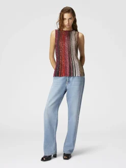 Top smanicato parzializzato a righe con paillettes