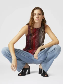 Top smanicato parzializzato a righe con paillettes